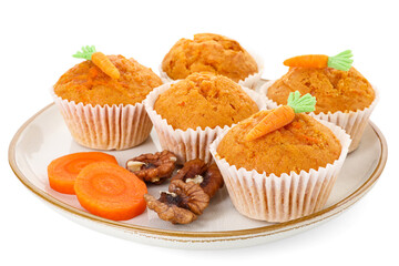 Tasty carrot muffins, walnuts and cut vegetable isolated on white