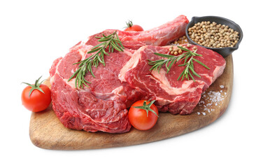 Pieces of raw beef meat, spices and tomatoes isolated on white