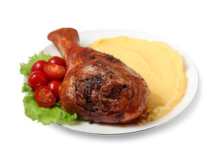 Baked turkey drumstick with mashed potato and tomatoes isolated on white