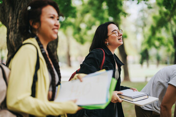 A group of diverse students working together on academic tasks in a serene park setting, fostering...