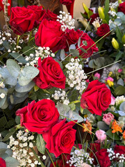A bouquet of vibrant red roses with lush greenery. Perfect for romantic gifts, weddings, and Valentine's Day, symbolizing love, passion, and elegance