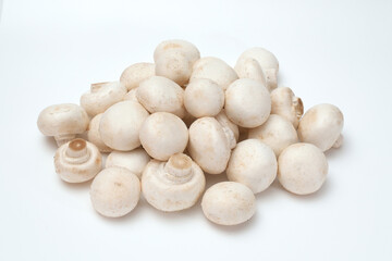 Fresh champignon mushrooms on a white background