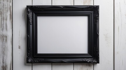 Elegant black picture frame on a white wooden background perfect for displaying art or photographs in a stylish setting.