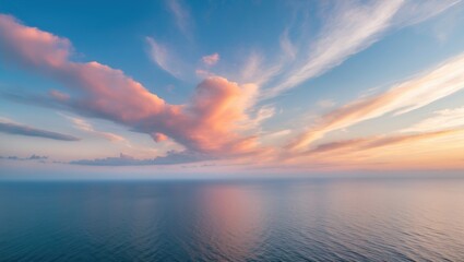 Fototapeta premium Serene Ocean Horizon Under a Dramatic Sky with Soft Clouds and Tranquil Water Reflections Ideal for Text Overlay