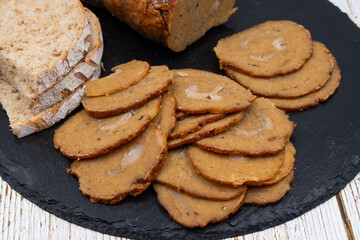 Vegan mock meat; made of wheat gluten; plant based. Steamed; roasted and sliced