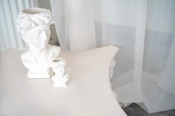 photo zone for photo sessions in antique and greek style antique sculptures in the interior.