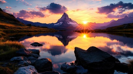 Majestic sunset over Matterhorn reflecting on alpine lake
