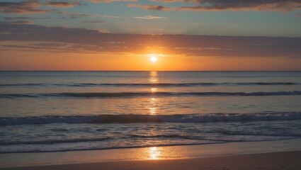 Obraz premium Golden sunset over calm ocean waves with soft clouds in the sky casting warm reflections on the water Copy Space
