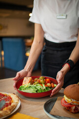 Serving at the restaurant: fresh salmon with vegetables