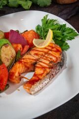 Grilled Salmon Steak with Roasted Vegetables and Lemon