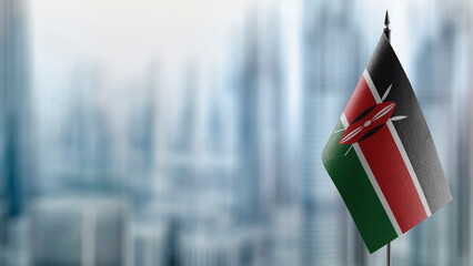 Small flags of the Kenya on an abstract blurry background