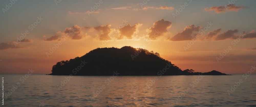 Poster sunset over a tranquil island viewed from the water with colorful clouds and reflection on the surfa