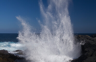 Gran Canaria, salt evaporation ponds Salinas el Bufadero around a blowhole Bufadero in the coast of Arucas municipality