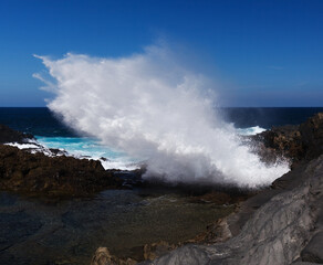Gran Canaria, salt evaporation ponds Salinas el Bufadero around a blowhole Bufadero in the coast of Arucas municipality
