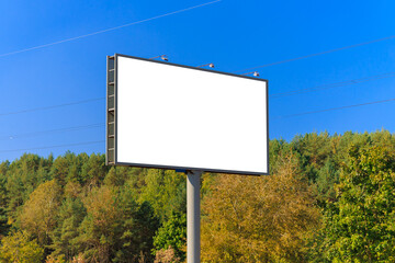 Background for design, white billboards on city streets and along roads in the summer day