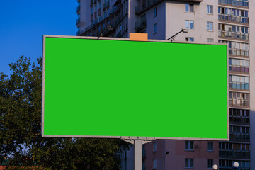 Background for design, white billboards on city streets and along roads in the summer day