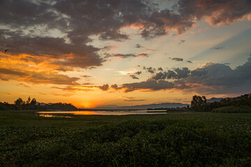 Sunset over lake and mountains