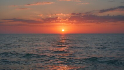 Obraz premium Sunset over calm ocean waters with colorful sky reflections and gentle waves Copy Space