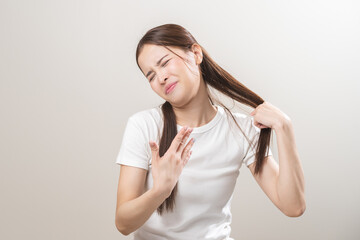 Hot weather and health care concept asian young woman suffering from heat, feeling discomfort with...