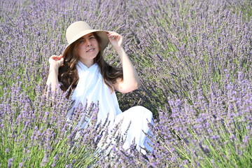 girl in white dress on lavender field,