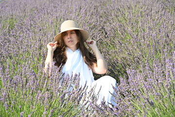 girl in white dress on lavender field,