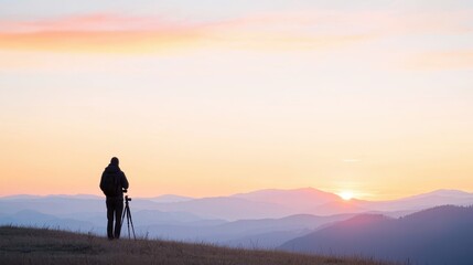 Obraz premium Serene Sunset Landscape Photography with Photographer Capturing Majestic Sunlight Over Hills and Mountains