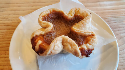 Home made butter tart on a white plate