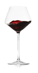 Red wine splashing in glass on white background