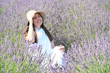 girl in white dress on lavender field,