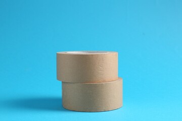 Rolls of masking tapes on light blue background