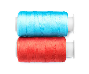 Spools of bright sewing threads isolated on white, top view