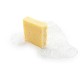 Yellow soap with foam on white background