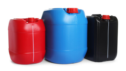 Three colorful plastic canisters isolated on white
