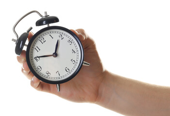 Man with black alarm clock on white background, closeup