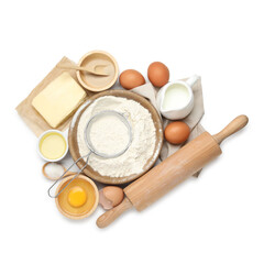 Rolling pin and different ingredients isolated on white, top view