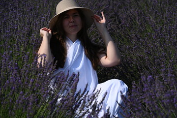 girl in white dress on lavender field,