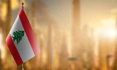Small flags of the Lebanon on an abstract blurry background