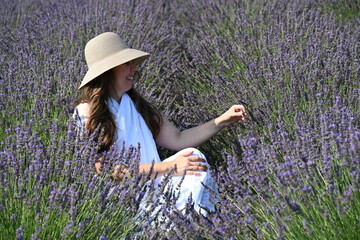 girl in white dress on lavender field,