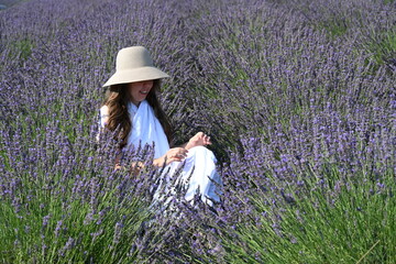girl in white dress on lavender field,