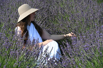 girl in white dress on lavender field,