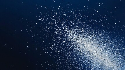 White powder explosion on dark blue background; abstract design