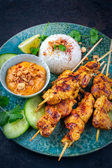 Sate Ayam- Grilled chicken satay sate skewers with peanut dipping spicy sauce, steamed rice and...