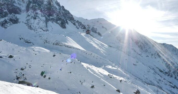 Chamonix-Mont-Blanc - France, January 2, 2025: The Aiguille du Midi gondola goes from 3,777 m to 2,317 m. It is the highest vertical cable car in the world at Plan de l'Aiguille. 4K 24FTP