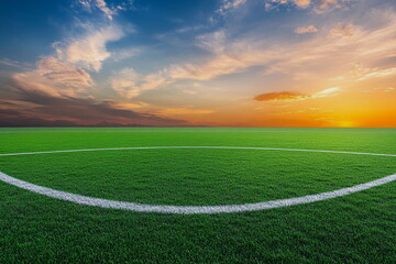 Obraz premium Soccer field with vibrant green grass at sunset. Warm golden light casts long shadows on the football pitch. A stadium in the background, creating a scenic view of sports and nature. 