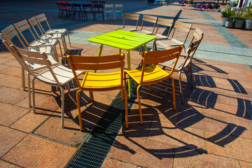 Colourful Metal chairs  with shadows  in sunny werther