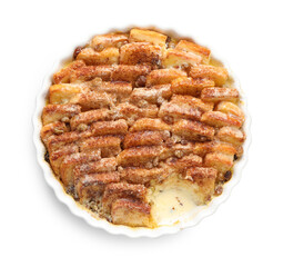 Delicious bread pudding with raisins and cinnamon isolated on white, top view