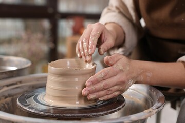 Hobby and craft. Woman making pottery indoors, closeup