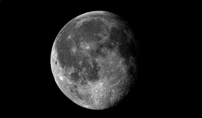 Naklejka premium Beautiful moon in one of its phases on a black background
