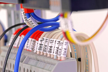 Marking of electrical wires using thermal printing on vinyl tape.