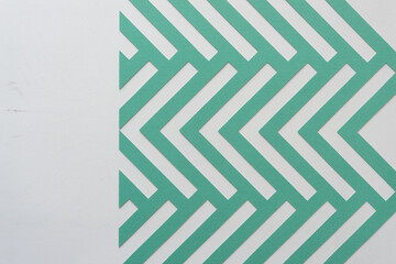 machine-cut paper herringbone pattern on blank paper